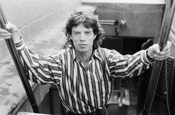 Rolling Stones singer Mick Jagger posing on top of the Daily Mirror Newspaper building