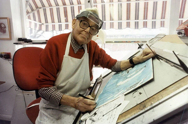 Ronald Carl Giles - Daily Express cartoonist at his drawing board in his studio
