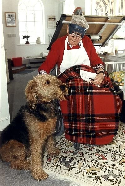 Ronald Carl Giles - Daily Express cartoonist at home in his studio with his dog Butch