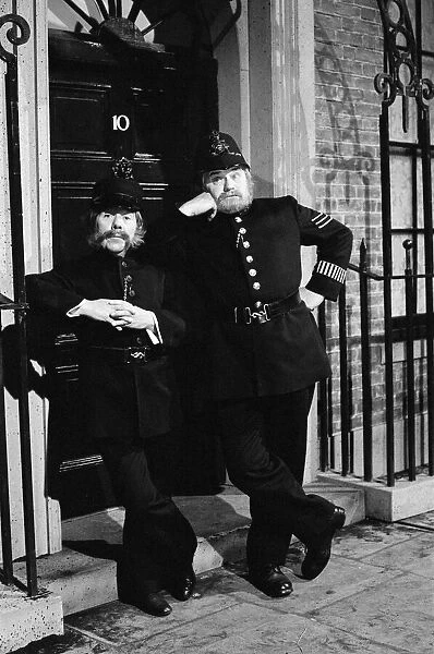Ronnie Corbett and Ronnie Barker dressed as policemen on duty outside 10 Downing Street