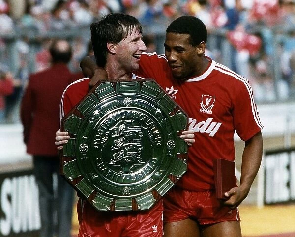 Ronnie Whelan and John Barnes of Liverpool FC with the Charity Shield August 1988
