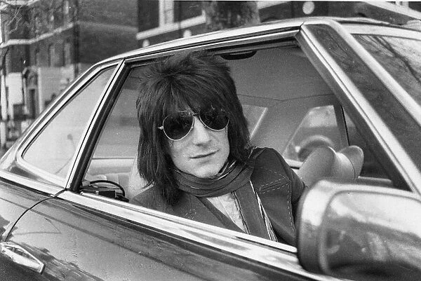 Ronnie Wood Guitar player with the Rolling Stones drives away from his Richmond home