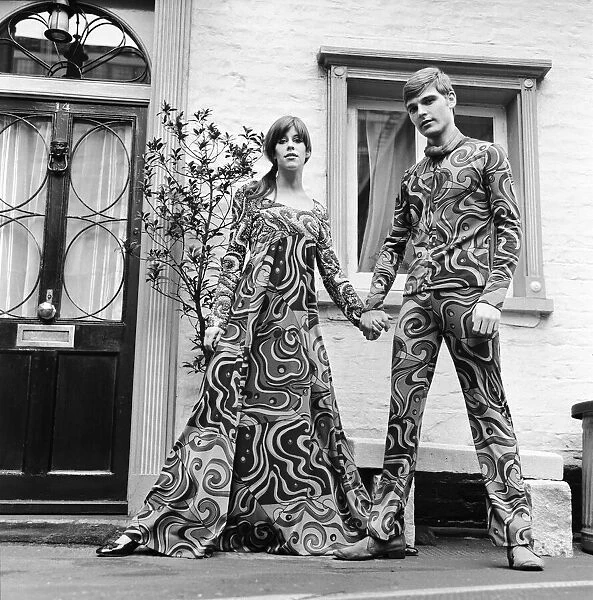 Rory Davis (the lady) with Mike Brown modelling psychedelic outfits at Joseph Bancroft