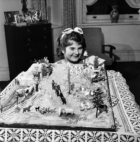 Rosemary Nolan playing with Toy Farm. December 1952 C6403