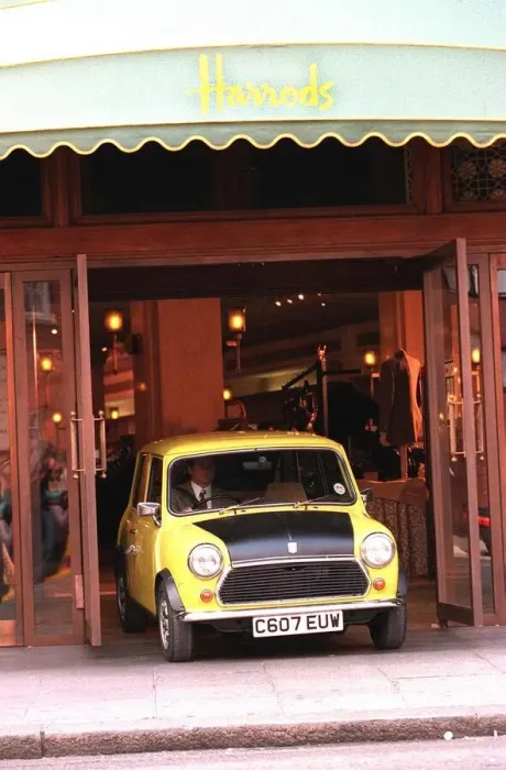 Framed Print : Rowan Atkinson Actor as Mr Bean filming at Harrods - motor cars mini