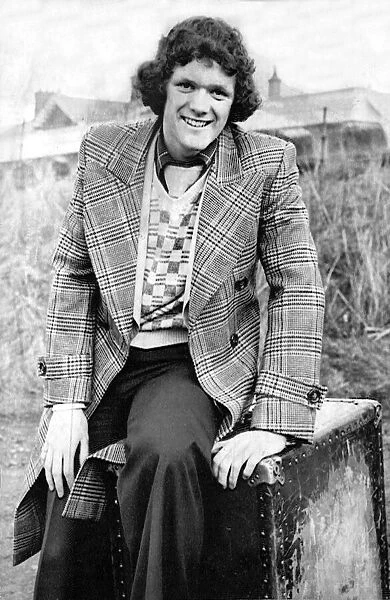 Roy Aitken sitting on team hamper February 1976