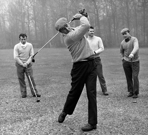 Roy Gratrix driving down the fairway on the Fairhaven Golf Links watched by Arthur Kaye