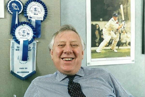 ROY HATTERSLEY IN HIS OFFICE WITH SHEFFIELD WEDNESDAY ROSETTES AND A PIC OF LEONARD