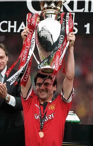 Roy Keane Manchester United Captain May 1999 holding the Premiership Trophy to