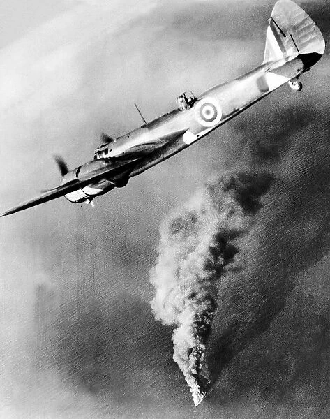 A Royal Air Force Bristol Beufighter aircraft flies over the burning hulk of a