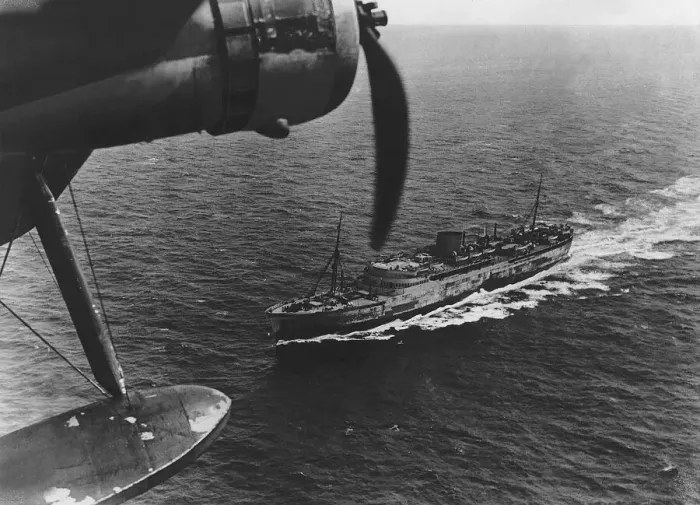 Framed Print : A Royal Air Force Coastal Command Sunderland flying boat flying over a transport ship Framed Print : A Royal Air Force Coastal Command Sunderland flying boat flying over a transport ship