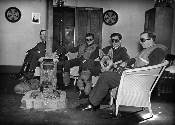 Royal Air Force night fighter pilots wear darkened goggles in the rest hut so that their