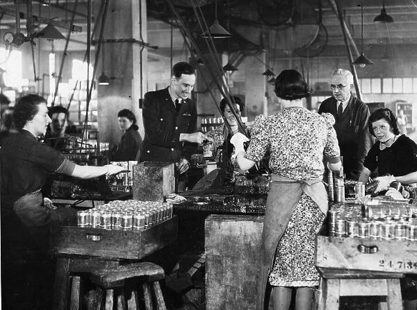 A Royal Air Force officer etched women workers at a factory near Reading