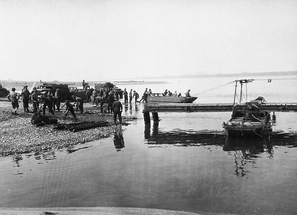 Royal Engineers on the banks of the Rhine launch a pontoon. 26th March 1945