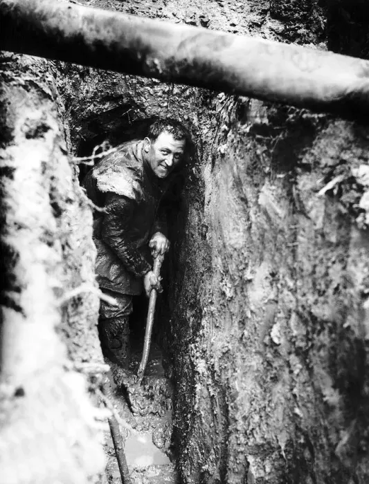 Framed Print : Royal Irish Fusilier Ferguson from Armagh clears mud from his trench in the forward lines Framed Print : Royal Irish Fusilier Ferguson from Armagh clears mud from his trench in the forward lines