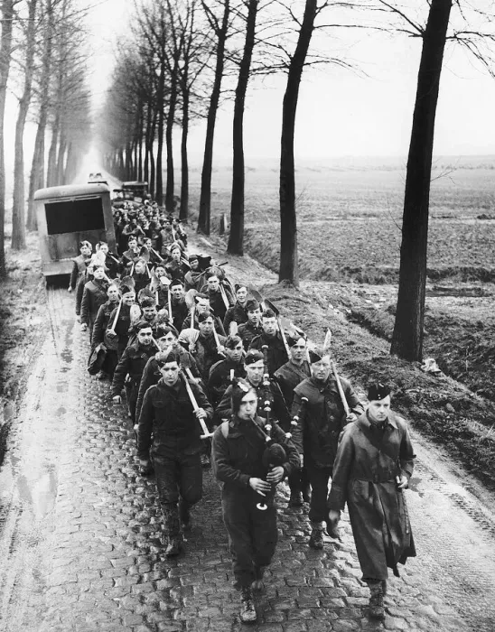 Framed Print : Royal Irish Fusiliers are piped back to their camp after a days work in France