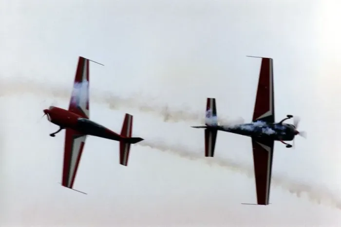 Framed Print : Royal Jordanian Falcons display team performing in their Extra EA300 aircraft Framed Print : Royal Jordanian Falcons display team performing in their Extra EA300 aircraft