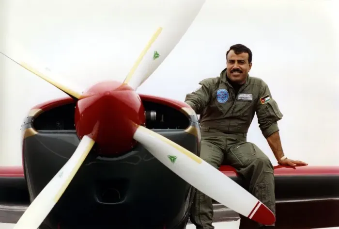 Framed Print : Royal Jordanian Falcons pilot Captain Tayseer Daboubi takes a break with his Extra EA300 Framed Print : Royal Jordanian Falcons pilot Captain Tayseer Daboubi takes a break with his Extra EA300