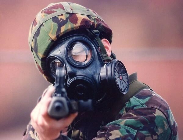 A Royal Marine in camouflage and gasmask