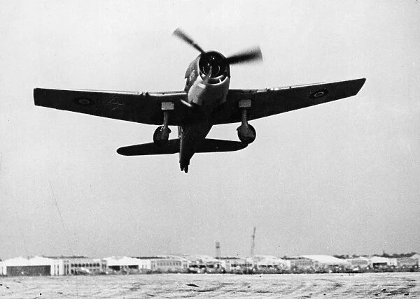 A Royal Navy Grumman Hellcat springs into the air at Roosevelt Field, Long Island