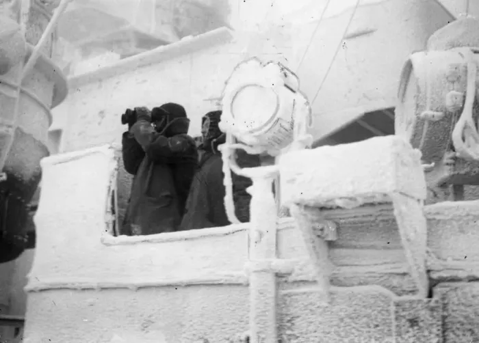 Framed Print : Two Royal Navy sailors, wrapped up against the bitter cold conditions Framed Print : Two Royal Navy sailors, wrapped up against the bitter cold conditions