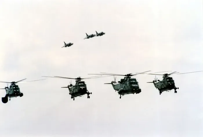 Framed Print : Four Royal Navy Sea King helicopters and three Sea Harriers in flight