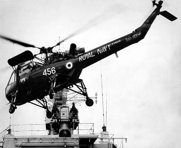 A Royal Navy Westland Wasp anti-submarine helicopter leaves HMS Yarmouth to fly to it