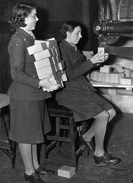 Royal Ordnance Factory. Private M Webster with Private Elsie Bolton, both of Liverpool