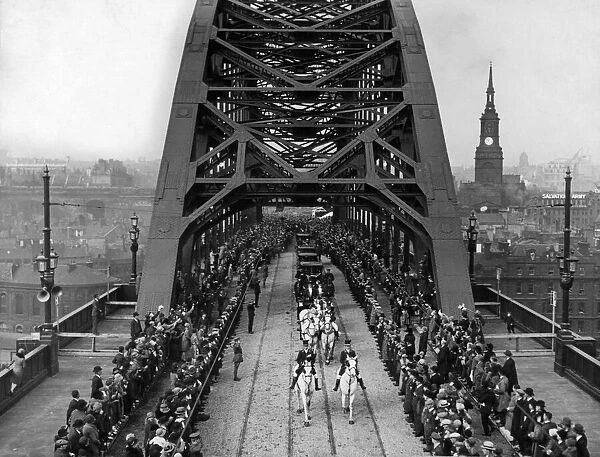 The Royal procession carrying King George V and Queen Mary passing the newly opened Tyne