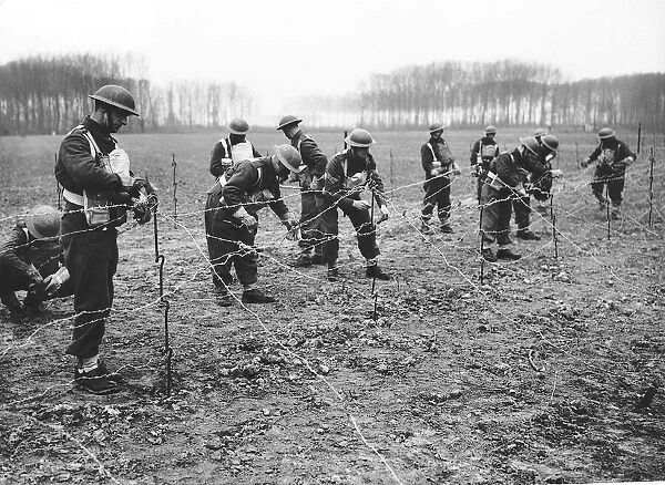 The Royal Scots lay barbed defences during WW2 1940