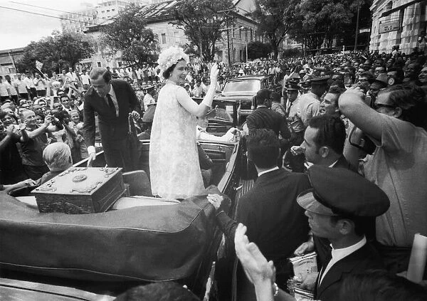 Royal Tours, Salvador, Brazil. Queen Elizabeth II waves from ther motorcade