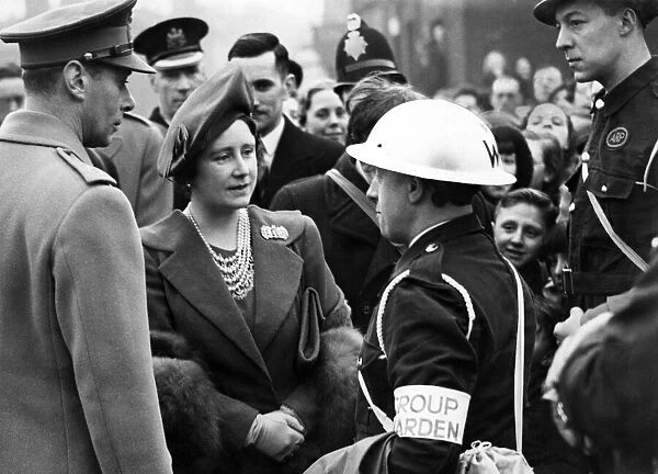 Royal visit to Salford - King George VI & Queen Elizabeth talking to a group warden in