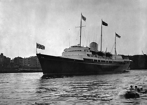 The Royal yacht Britannia passes the 'head shipman'