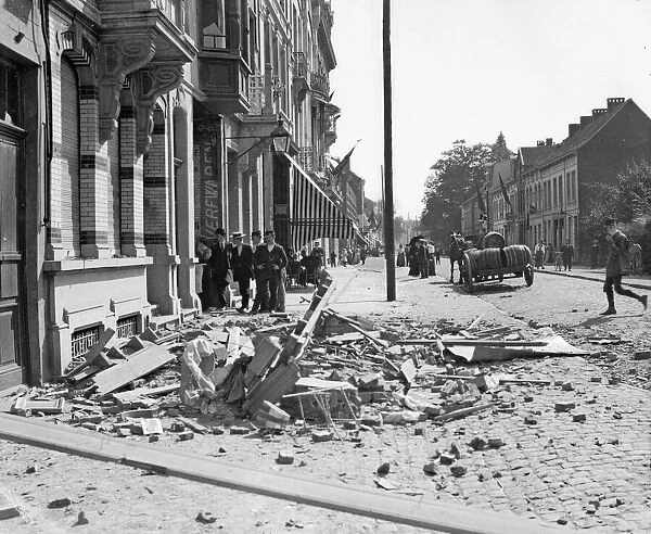 Rubble in the streets of Antwerp the result of one of the three air raids made