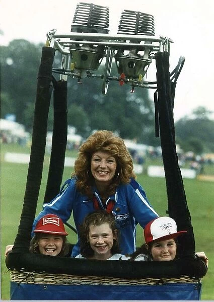 Rula Lenska actress stands in hot air balloon with three children. September 1988