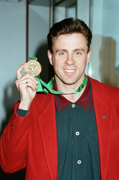 Runner Tom McKean arrives home from the 1993 IaF World Indoor Championships in Toronto