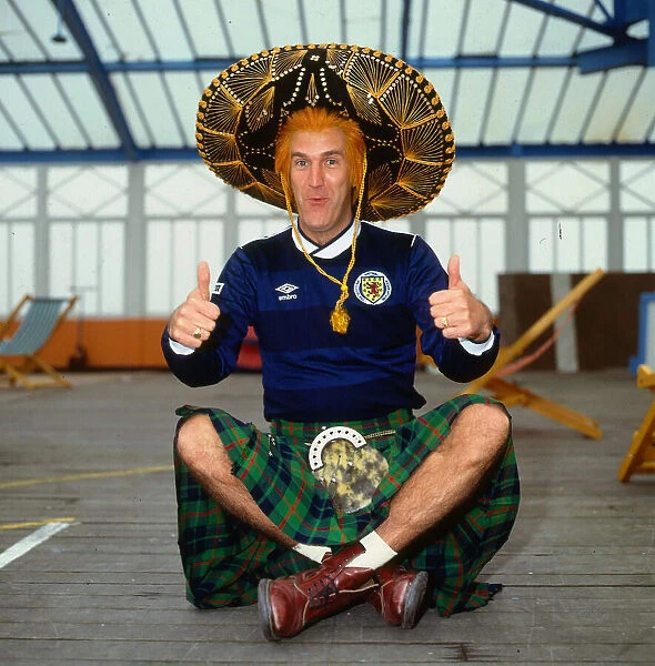 Russ Abbot comedian May 1986 wearing Scotland football top sombrero thumbs up