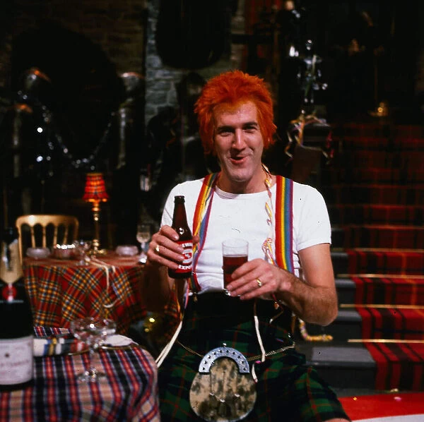 Russ Abbot comedian November 1994 dressed as Jimmy wearing kilt holding bottle of beer