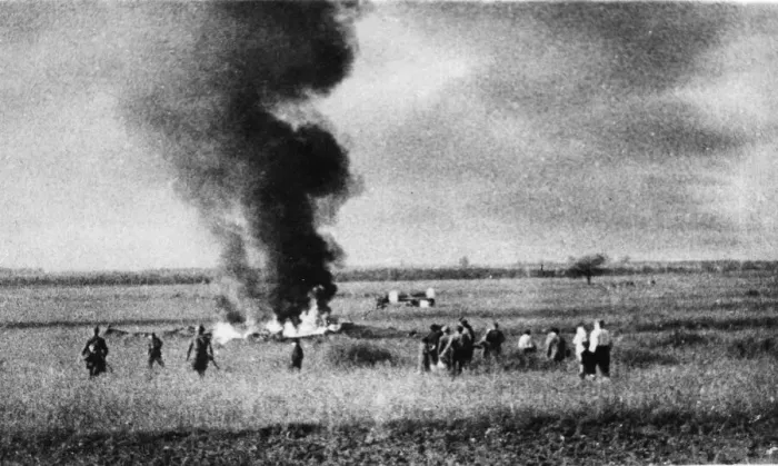 Framed Print : Russian soldiers and collective farmers watch the scattered remains of a German raiding