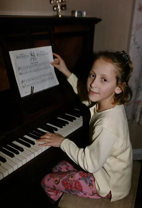 Framed Print : Ruth Walton one of the Walton Sextuplets sits at a piano to play dbase