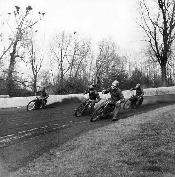 Rye house speedway school. Manager Alan Mitchele with Alan Briggs explains how to corner