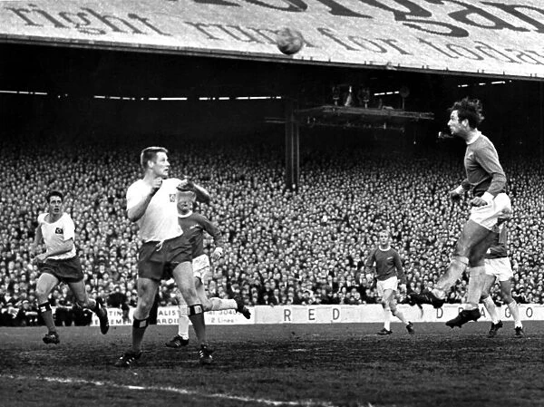 s Norman Dean heads the ball over the head of Hans Schulz towards goal -1st May 1968