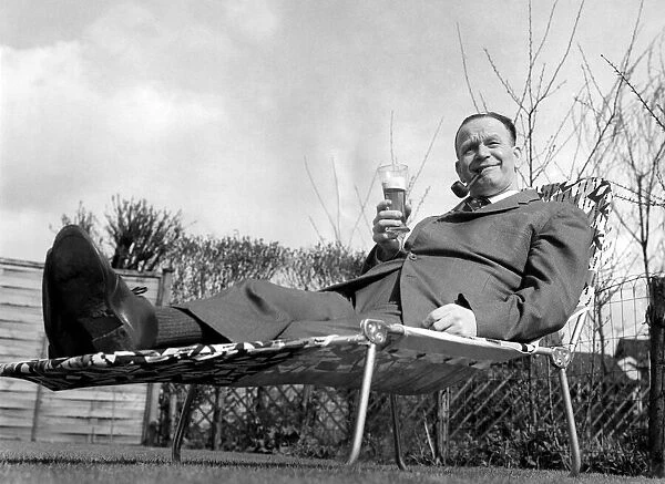 Sacked Manchester City manager George Poyser relaxes in the sunshine with a glass of beer