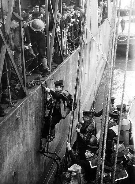 Sailors board HMS Glasow as they prepare for another trip to the beaches of Normandy