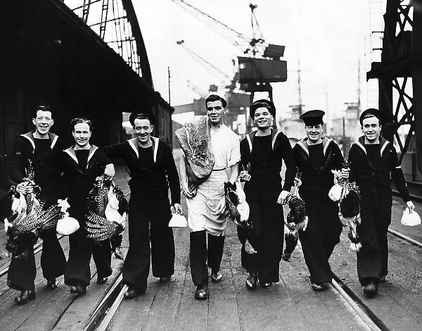 Sailors from minesweepers taking aboard Xmas fare at an East Coast dock