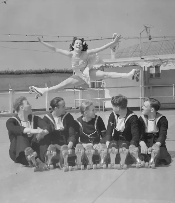 Framed Print : Sailors at the Southsea rink watch one of the performers perform an aerial splits 21st Framed Print : Sailors at the Southsea rink watch one of the performers perform an aerial splits 21st