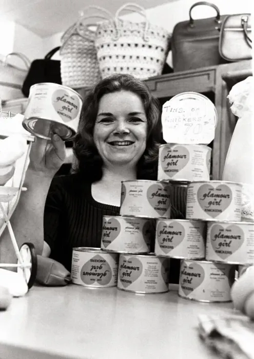 Framed Print : Salesgirl Delia Dixon showing off some of the tinned knickers she has on sale in her shop Framed Print : Salesgirl Delia Dixon showing off some of the tinned knickers she has on sale in her shop