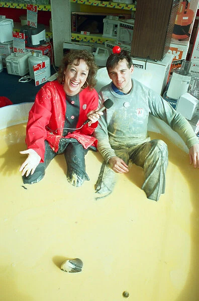Salesman John Cogger sitting in two hundred gallons of custard for Comic Relief at