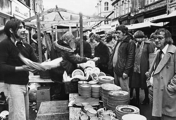 Salesman rattling plates during his sales pitch at Pontypridd 25th November 1976