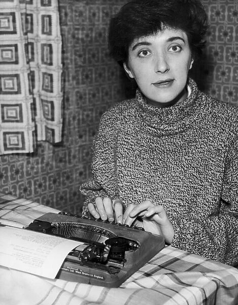 Salford born playwright Shelagh Delaney pictured at work on her typewriter at her home in